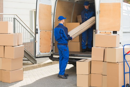 Man with a van in Stjohnswood loading furniture for a local move