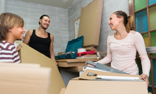 Removal team preparing items for a safe van loading process