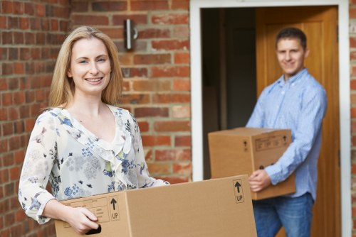 Staff checking load security and hazards during a house move