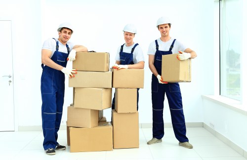 Professional movers carrying household items in Stjohnswood