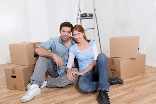 Room-by-room packing setup with labeled boxes for a Stjohnswood move