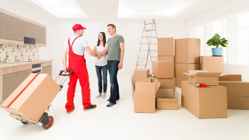 Staff in PPE preparing furniture for a safe removal van service