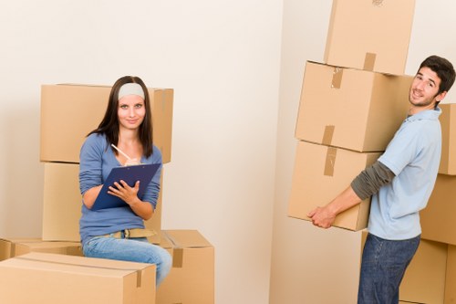 Removal crew loading furniture into a van with care