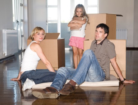 Moving boxes and furniture in a St John’s Wood apartment loading area